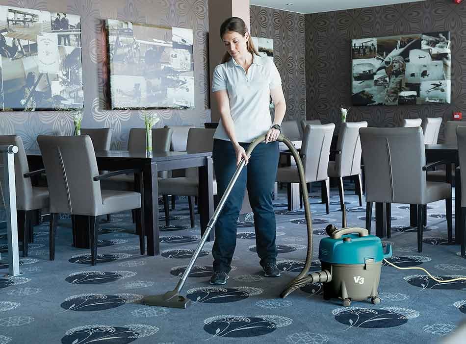 Tennant vacuum cleaning floor of restaurant Tennant vacuum cleaning floor of restaurant