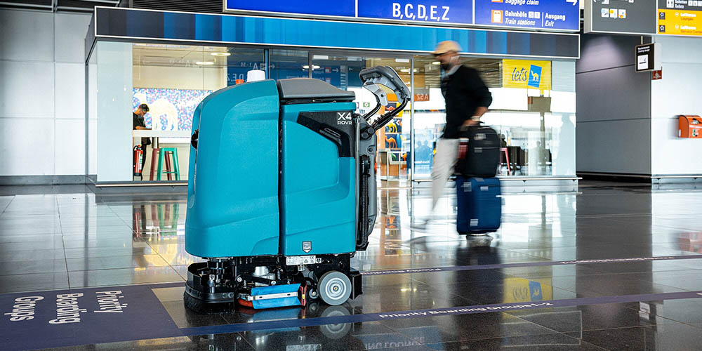 Side view of Tennant X4Rovr Robotic Floor Scrubber in Frankfurt Airport Side view of Tennant X4Rovr Robotic Floor Scrubber in Frankfurt Airport