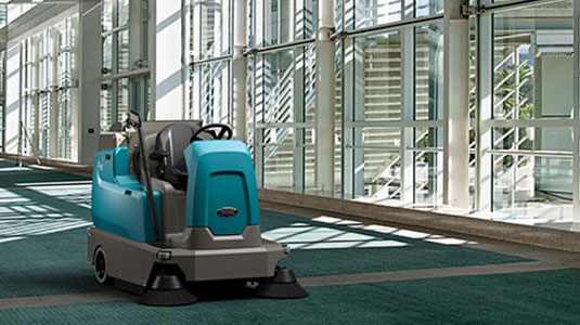 Tennant's new S16 ride-on carpet sweeper cleaning a convention centre Tennant's new S16 ride-on carpet sweeper cleaning a convention centre